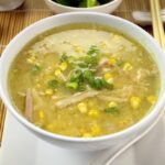 chicken corn soup in a white bowl