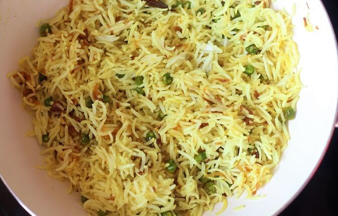 mixed peas pulao recipe in a white pan