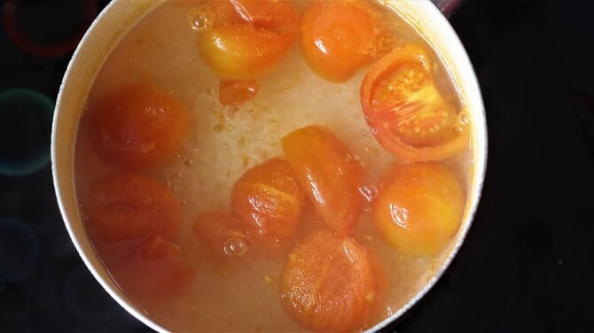 boiling tomatoes for making tomato rasam