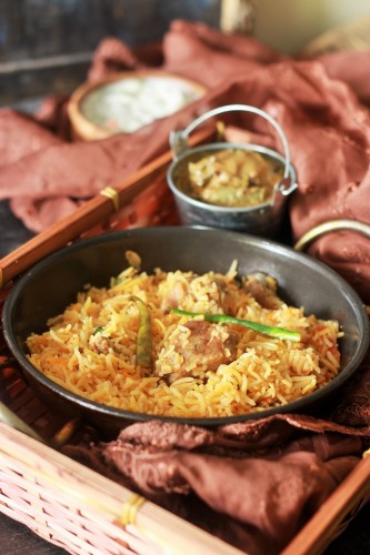 Lucknowi Mutton Biryani Recipe or the Awadhi Biryani. An absolutely delicious recipe cooked with flavorful spices in Dum Pukht method