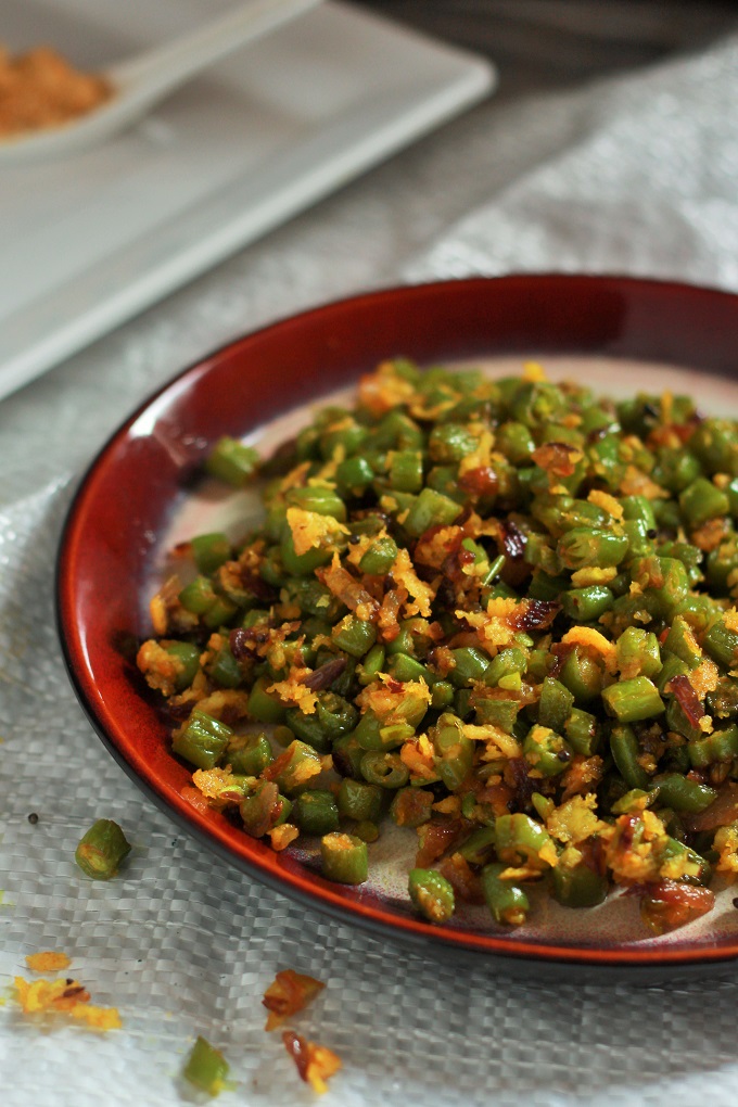 South Indian Green Beans Poriyal Recipe - This dish will add a splash of colour to any table! It take so less time to make and takes the humble green beans to a whole new level.