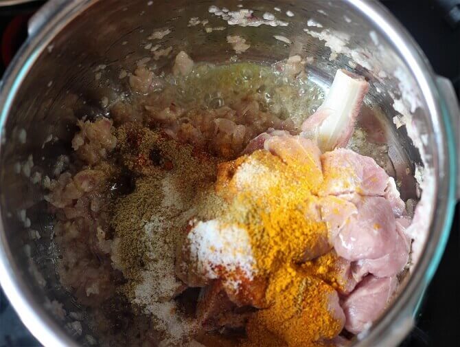 adding mutton, spices, salt to the fried onion