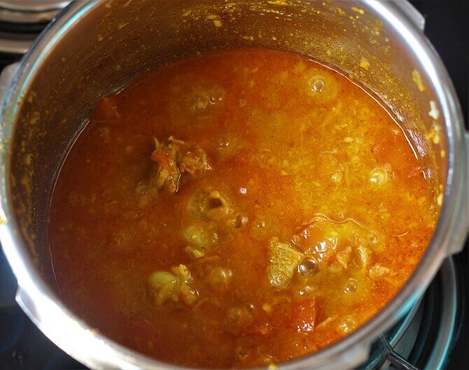 cooked mutton in a pressure cooker for making gawar ki sabzi
