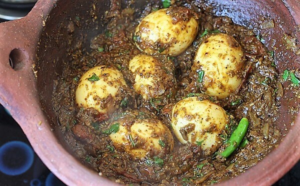 top view of chettinad egg curry in a clay kadai