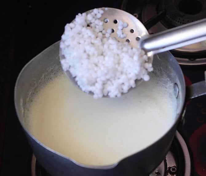 adding soaked javvarasi to boiling milk