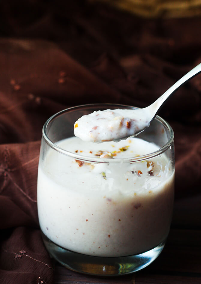 paal payasam recipe in a spoonful on top of a glass
