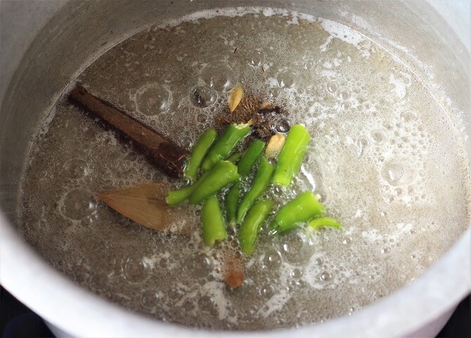 frying green chili, spices in oil, ghee