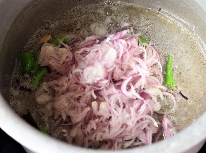 frying onion for making south indian chicken biryani recipe