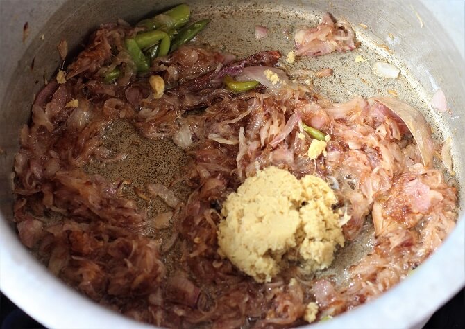 ginger garlic added in the browned onion in a vessel