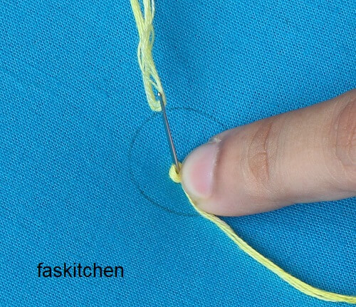 3. pulling the needle down the fabric