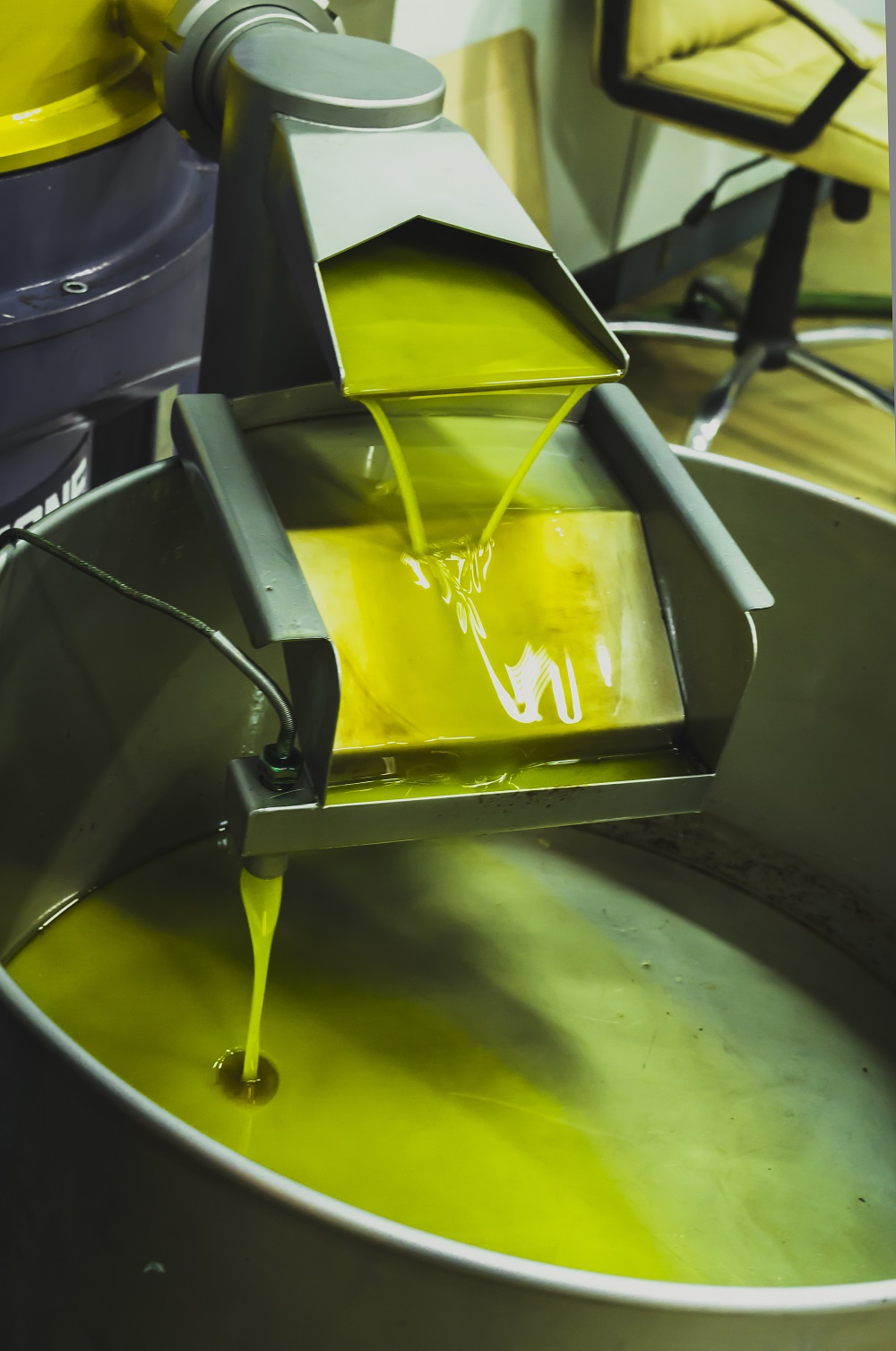 Vertical shot of olive oil extraction process 